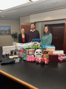 Gallagher volunteers with gifts we collected for House of Ruth of Maryland Adopt-a-Family