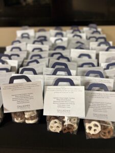 Special gift bags of chocolate-covered pretzels for attendees of the firm pro bono event